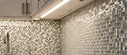 Kitchen mosaic tile showing reflective finish and clean countertop edge